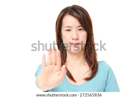 Japanese woman making stop gesture 