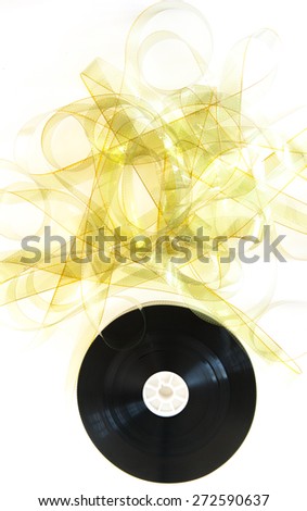Unrolled 35 mm movie reel with unrolled yellow film strip on white background vertical frame