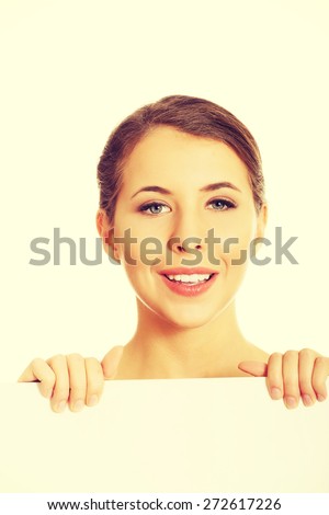 Young cheerful woman holding white banner