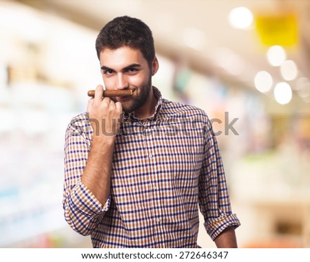 man smelling cigar