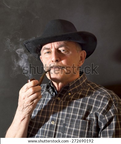 Cowboy in hat with Pipe