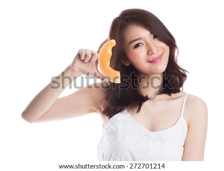 Portrait of a young beautiful asian woman eating melon on white background