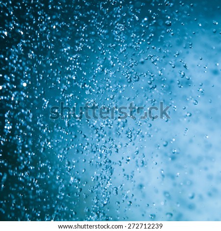 Abstract background of blue water drops.