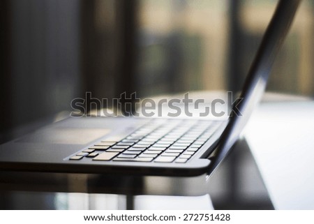 Modern laptop in a room