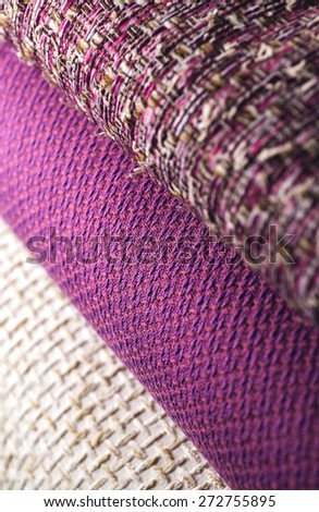 Rolls of colorful fabric as a vibrant background image.