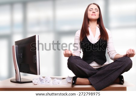 Beautiful business woman is dreaming in his office