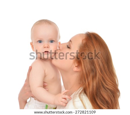 Young mother woman holding and kissing in her arms new born infant child baby kid girl isolated on a white background