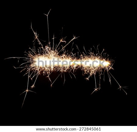 Burning sparklers isolated on black background. Sparks explosion. High resolution.