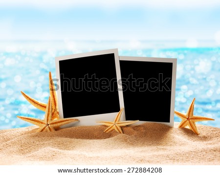 Photo card on sand beach.Close up