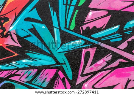 Beautiful street art graffiti. Abstract creative drawing fashion colors on the walls of the city. Urban Contemporary Culture Royalty-Free Stock Photo #272897411