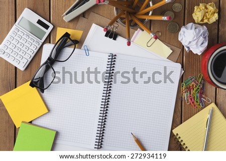 Miscellaneous office material on wooden background, directly above shot Royalty-Free Stock Photo #272934119