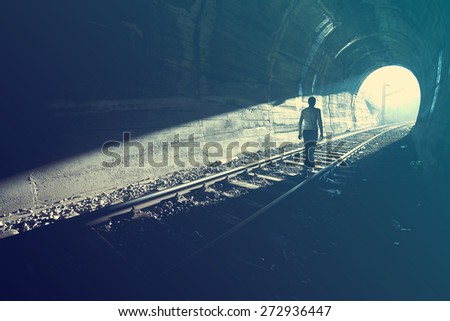Exit from darkness - Light at end of tunnel Royalty-Free Stock Photo #272936447