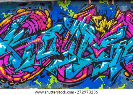 Beautiful street art graffiti. Abstract creative drawing fashion colors on the walls of the city. Urban Contemporary Culture Royalty-Free Stock Photo #272973236