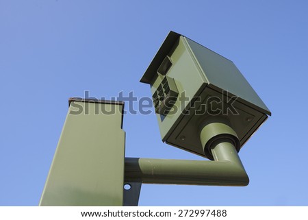 Speed camera control against clear blue sky