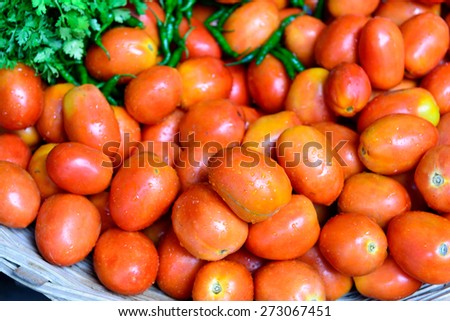 lots of fresh tomato with water droplets
