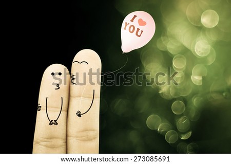 Finger cartoon Hug and kiss and holding balloon on green bokeh background , retro style 