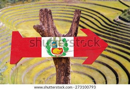 Peru Flag wooden sign with Pisac background - Inca ruins in the sacred valley