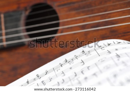 Music notes and vintage guitar