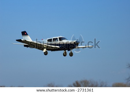 A light aircraft landing. Royalty-Free Stock Photo #2731361