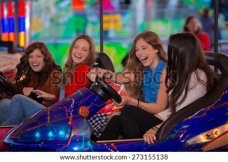 group of kids or girls having fun at fair.  Royalty-Free Stock Photo #273155138