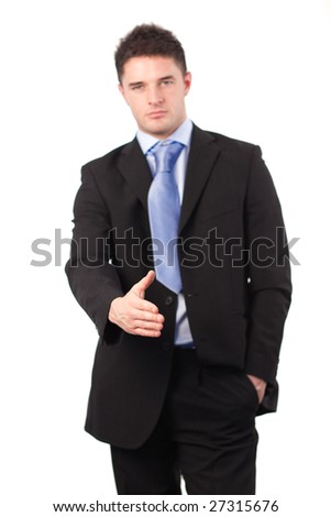 Businessman offering a handshake at camera