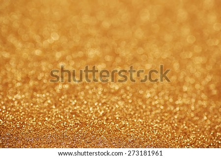 Gold nuggets sparkling carpet. Close-up view, very shallow deep of field . Macro.