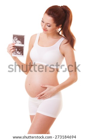 Pretty pregnant woman holding ultrasound scan. Isolated on white background