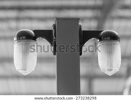 classic lamp pole close up in black and white 