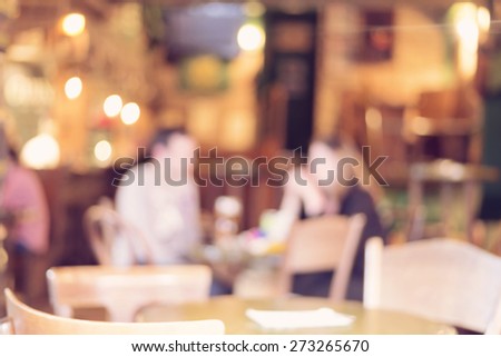 Blurred cafe with blurred people - retro effect style photo
