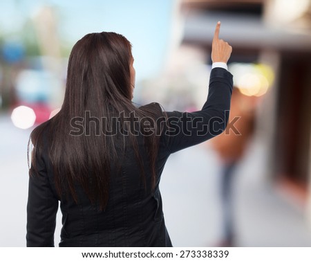 cool business-woman pointing up