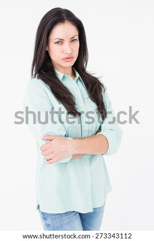 Serious woman looking at camera on white background