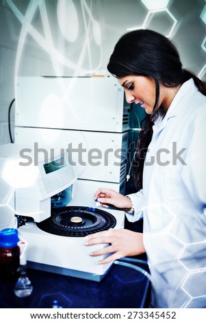 Science and medical graphic against focused scientist using a centrifuge
