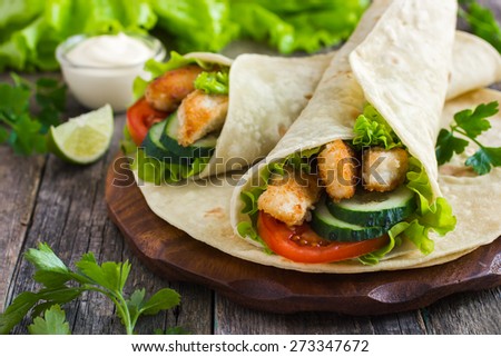 tortilla wrap with chicken and vegetables, selective focus