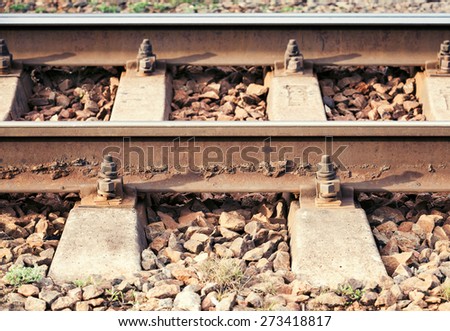 Side view of modern railway details, close-up photo with selective focus and shallow DOF