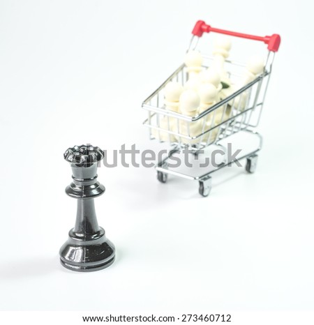 Black queen and white pawn inside trolley background