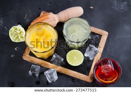 Different fresh cocktail on wooden background, selective focus
