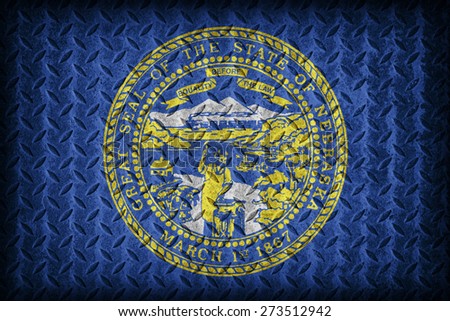 Nebraska flag pattern on diamond metal plate texture ,vintage style