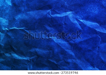 Grunge black and blue crumpled paper texture.