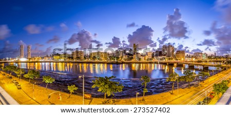 Panoramic view of the city of Recife in Pernambuco, Brazil at sunset showcasing its mix historic and modern architecture and the Capibaribe river cross it on s warm summer day. Royalty-Free Stock Photo #273527402