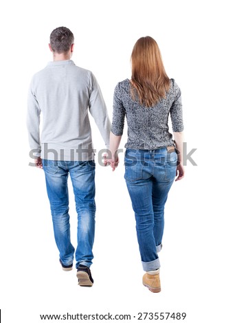  Back view going couple. walking friendly girl and guy holding hands. Rear view people collection. backside view of person. Isolated over white background. Holding hands couple went off. 