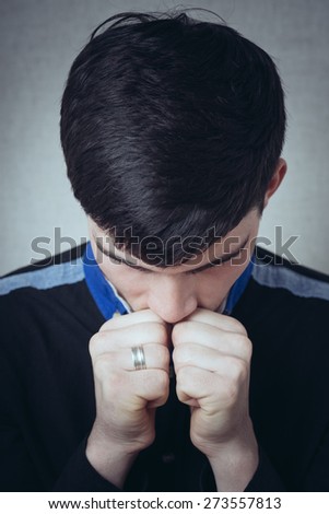 young man prays