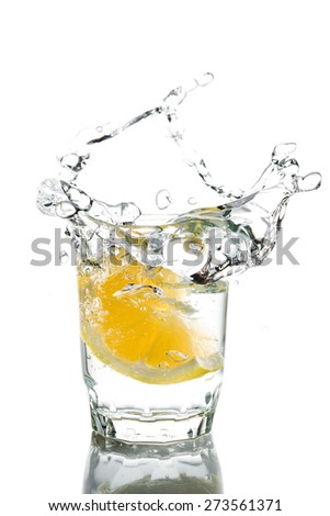 Splash of water with lemons isolated on white background