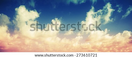 Colorful cloudy sky panoramic background, vintage toned effect, instagram style photo filter