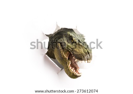 close up dinosaur through the paper wall Royalty-Free Stock Photo #273612074