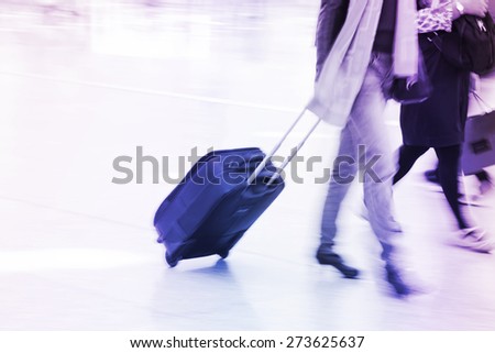 business people departure with luggage at airport