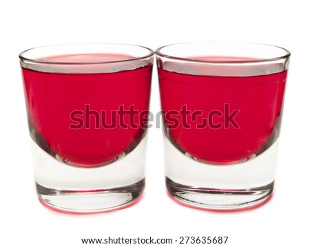 Purple Hooter shots isolated on white background. Made from 0.5 parts vodka, 1 part raspberry liqueur, 0.25 parts lime juice Royalty-Free Stock Photo #273635687