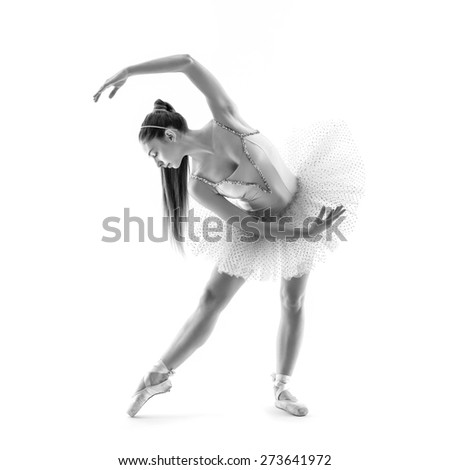 Young classical dancer isolated on white background. Ballerina project. Black and white image.