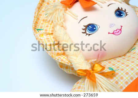 Detail of a colorful doll.