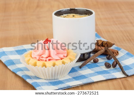 Creamy basket with cinnamon on the wood background
