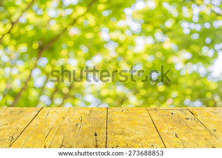 blur image of Abstract Bokeh of tree green color background.